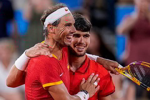 Rafael Nadal and Carlos Alcaraz react after losing the match
